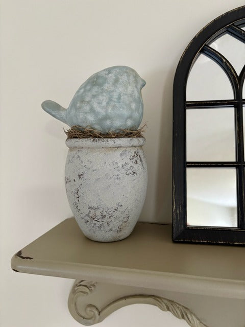 Ceramic bird on wood base