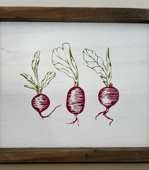 Wooden sign with illustrations of radishes on a white background