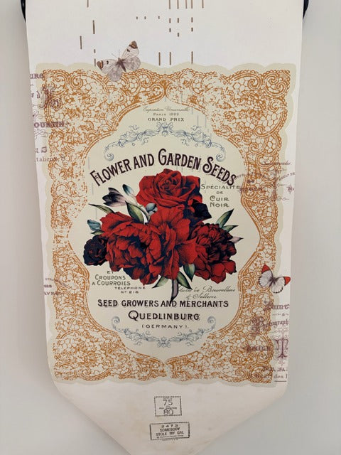 Decorative piano roll with floral design and text on a white background