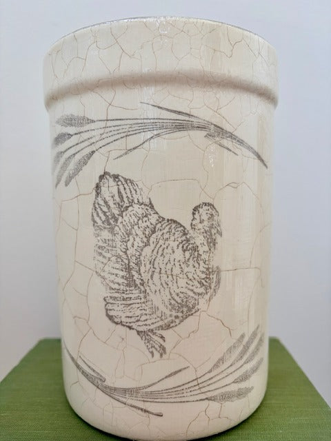 Ceramic jar with a cracked texture and a turkey illustration 