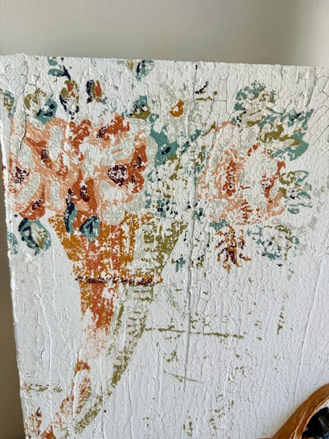 Textured panel with floral pattern on a plain background