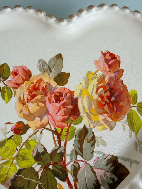 Decorative plate with floral design on a textured surface