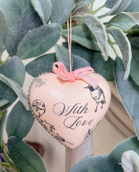 Heart-shaped ornament with 'With Love' text and bird design