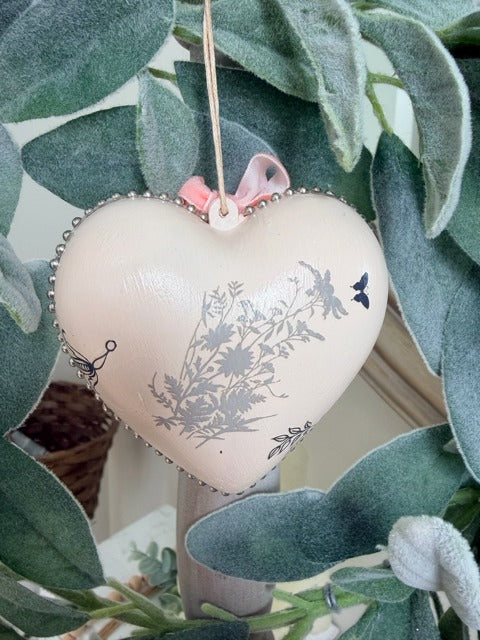 Heart-shaped decorative item with floral patterns 