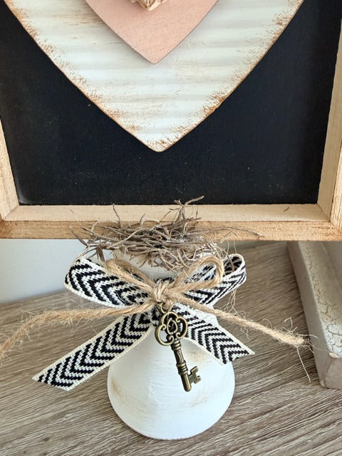 Decorative bow with a key charm 