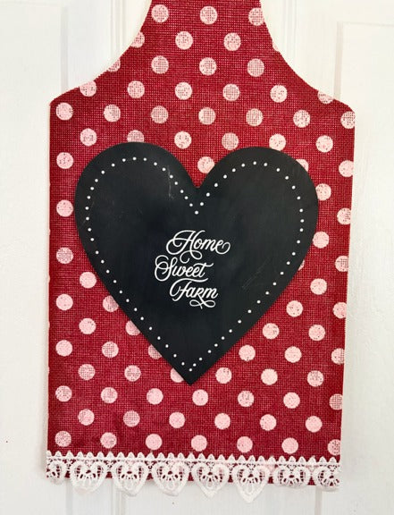 Red polka dot cutting board with a black heart-shaped patch and 'Home Sweet Farm' text.