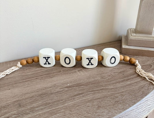 Decorative garland with 'XO' beads.