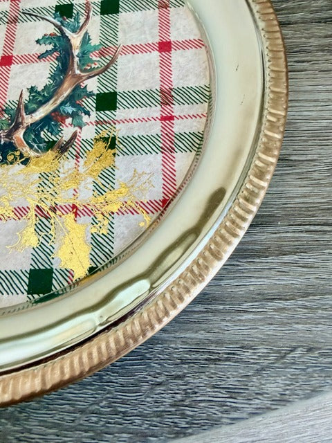 Decorative plate with a plaid pattern and deer design 