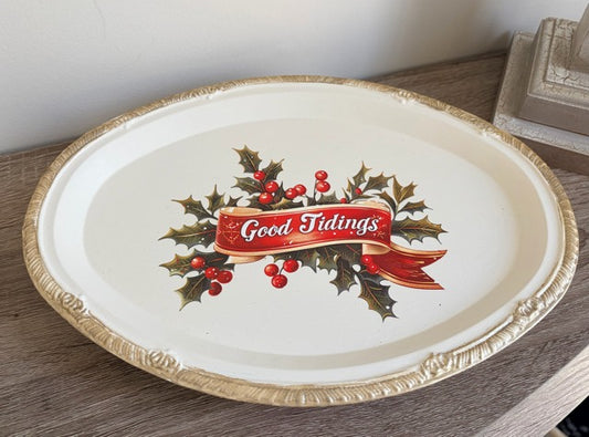 Decorative tray with 'Good Tidings' text and holly design 