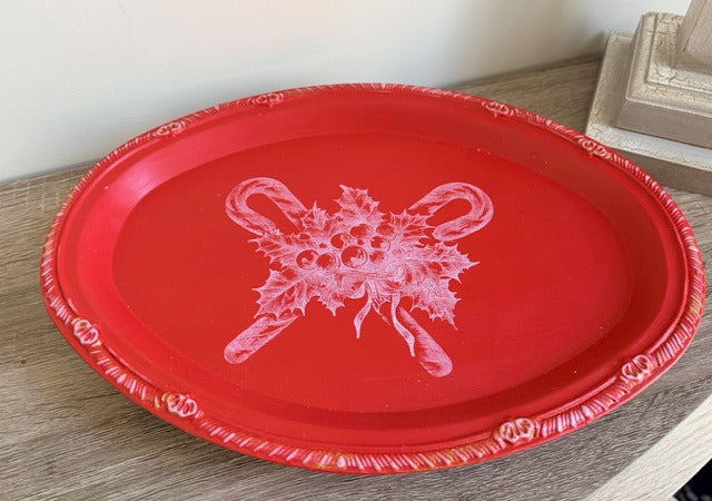 Red tray with white floral candy cane design