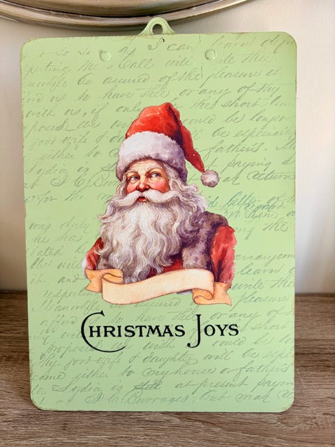 Light green clipboard with Christmas-themed decorations and text 