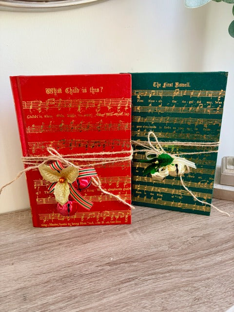 Two books with decorative ribbons 