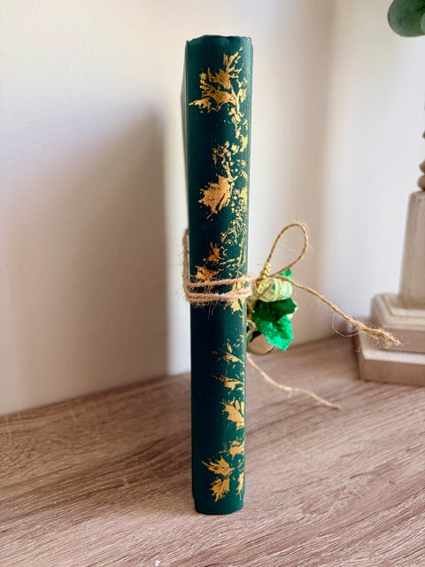 Green book with gold designs 