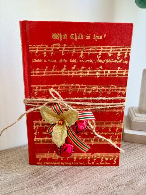 Red book with musical notes and Christmas decorations 