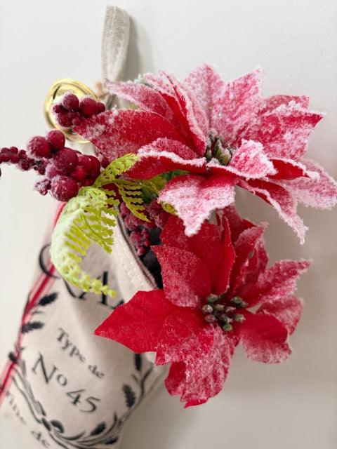 Decorative arrangement with red and pink flowers and berries on a white background