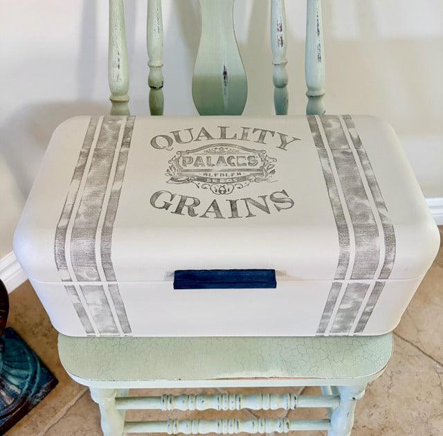 Bread box with 'Quality Grains' design 