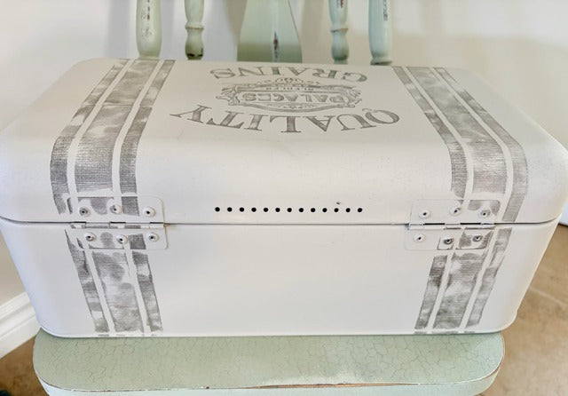 White breadbox with newspaper print design