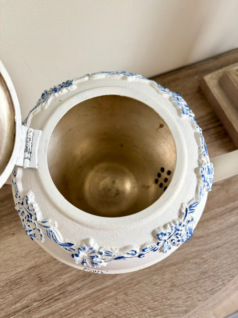 Painted white teapot with blue nest image and white faux florals