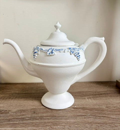 Painted white teapot with blue nest image and white faux florals