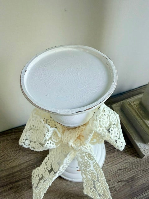 Top of wider candlestick.