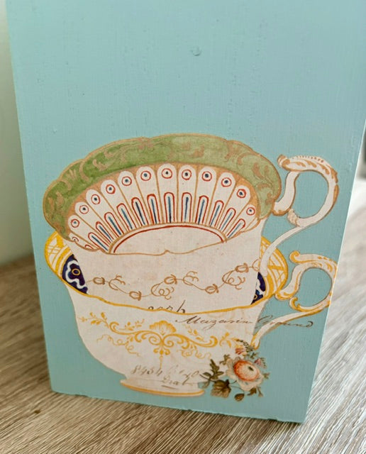 Close up of stacked teacup transfer.