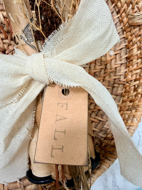 Close up of fabric bow and "fall" tag