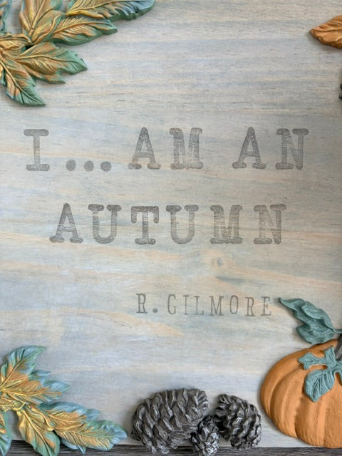 Fall themed wood panel with writing,"I am an autumn.  R. Gilmore"
