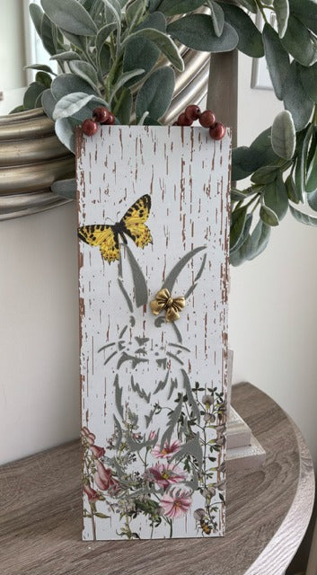 Decorative wooden sign with butterfly and floral design 