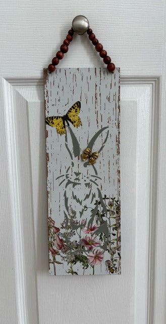 Decorative wooden sign with butterfly and floral design 