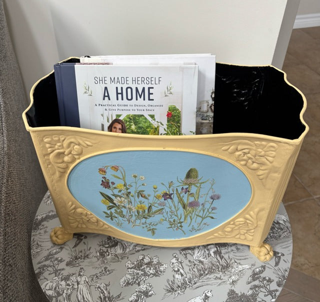 Decorative box with a floral design on a blue background