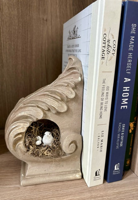 Painted corbel with a nest, bird and eggs