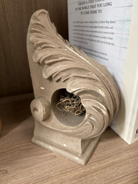 Painted corbel with a nest, bird and eggs