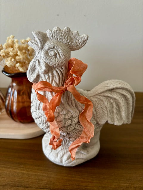 Decorative ceramic rooster with peach ribbon
