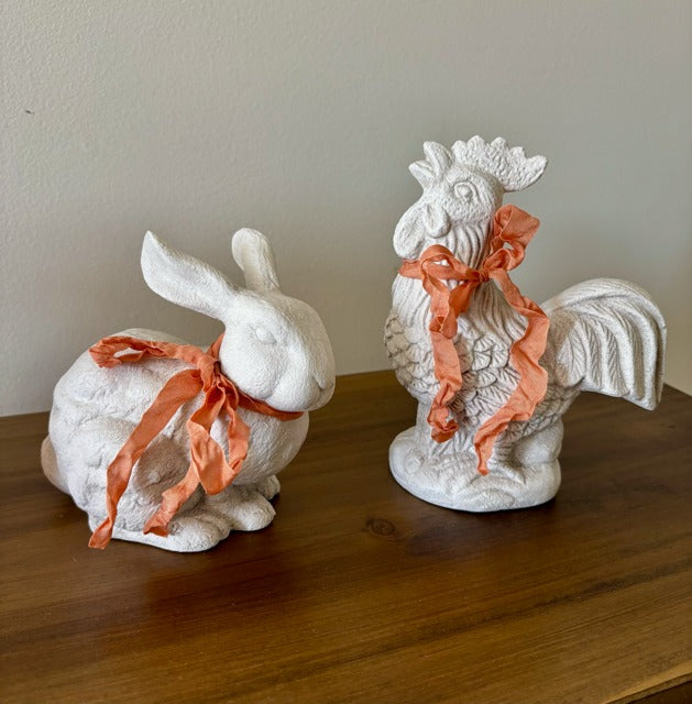 Decorative ceramic rabbit and rooster with peach ribbons 