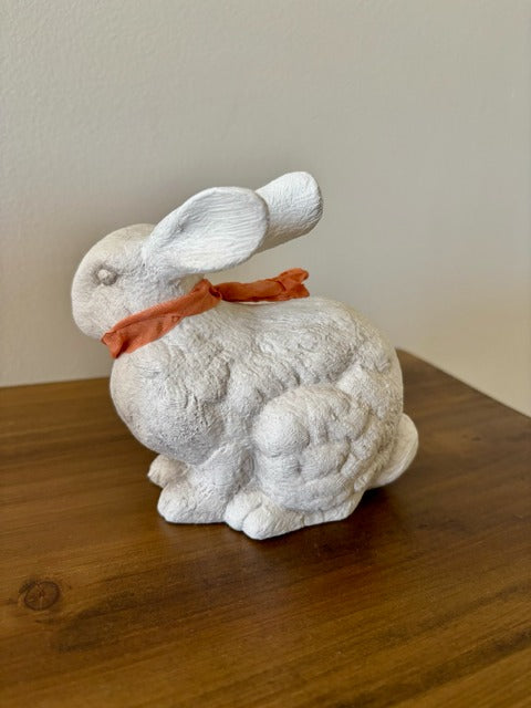 Decorative ceramic rabbit with peach ribbon