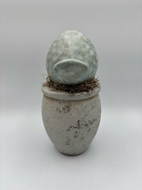 Ceramic bird on wood base
