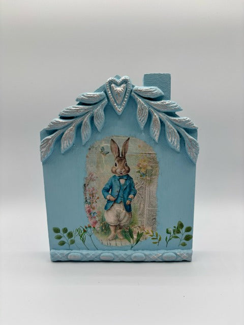 Decorative blue house with a rabbit illustration 