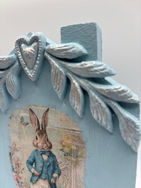 Decorative blue house with a rabbit illustration 