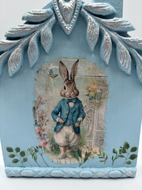 Decorative blue house with a rabbit illustration 