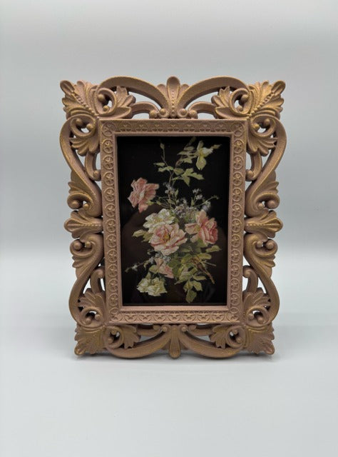 Decorative pink frame with floral transfer on a white background