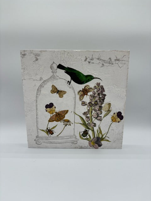 Decorative wood panel with butterflies, flowers, and a bird on a white, textured background