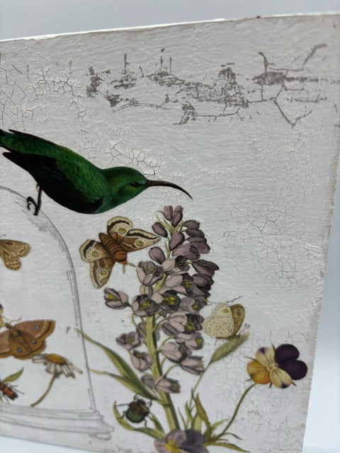 Decorative wood panel with butterflies, flowers, and a bird on a white, textured background