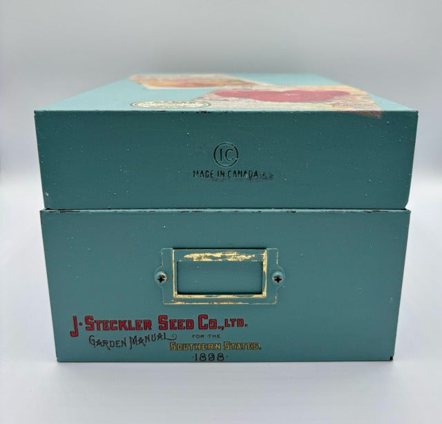 Teal box with vintage design and text on a white background
