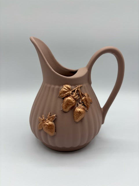 Pink ceramic pitcher with clay rose gold strawberries
