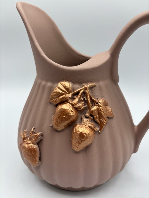 Pink ceramic pitcher with clay rose gold strawberries