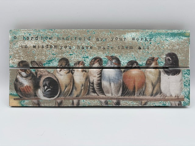 Decorative wooden panel with birds and text on a light gray background