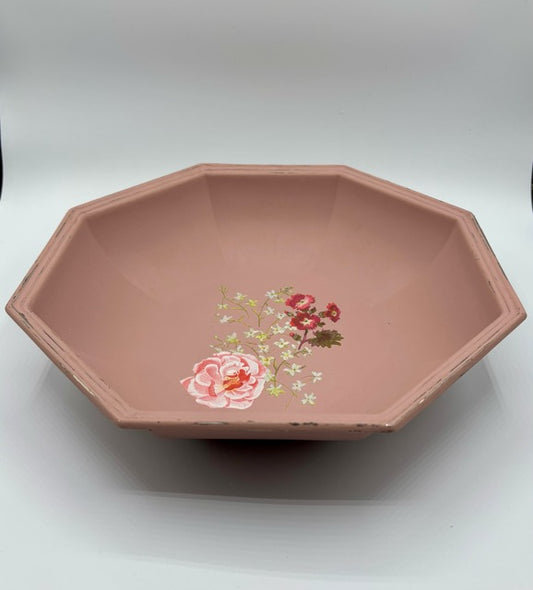 Octagonal pink dish with floral design on a white background