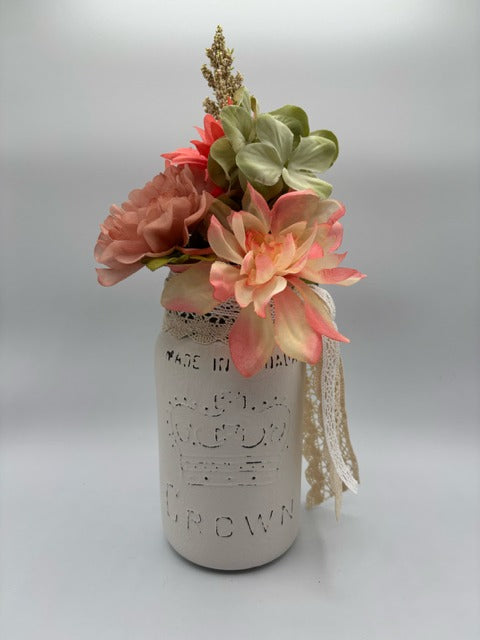 Decorative mason jar with lace and flowers 