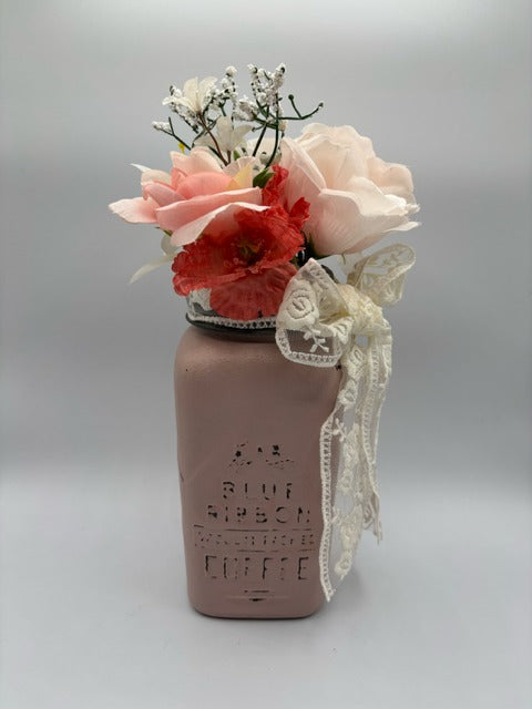 Decorative mason jar with lace and flowers 