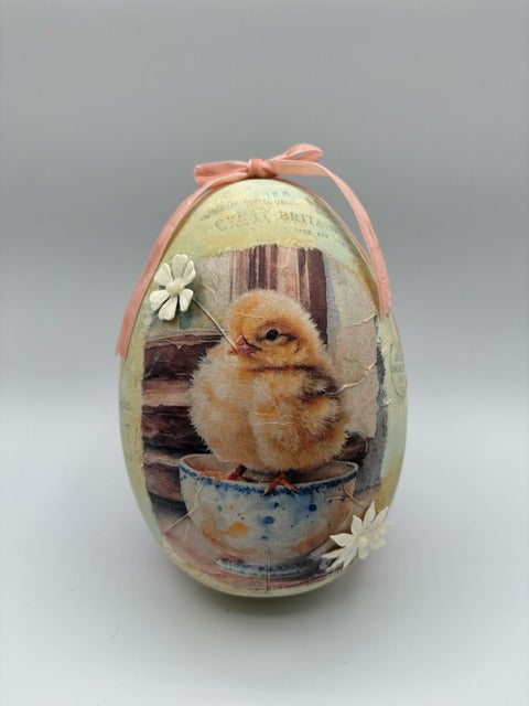 Decorative Easter egg with a chick design 